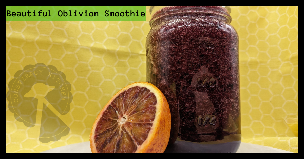 Close up of the beautiful oblivion smoothie and half a blood orange.